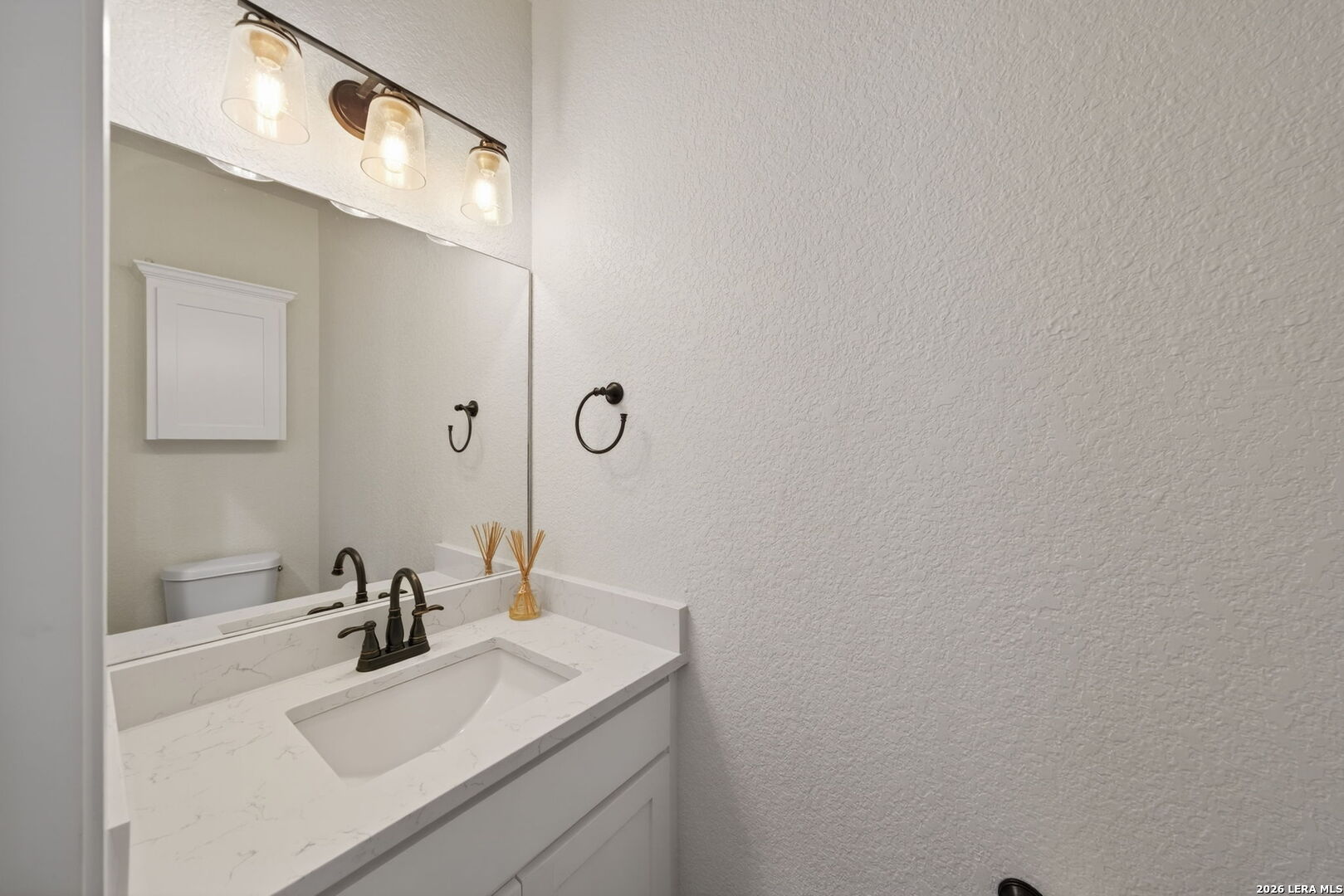 616 Crossman Fischer, TX 78623 - Photo 19 of 48 a bathroom with a sink and a mirror