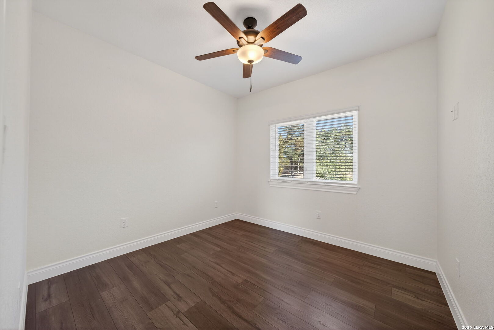 616 Crossman Fischer, TX 78623 - Photo 22 of 48 an empty room with wooden floor and windows