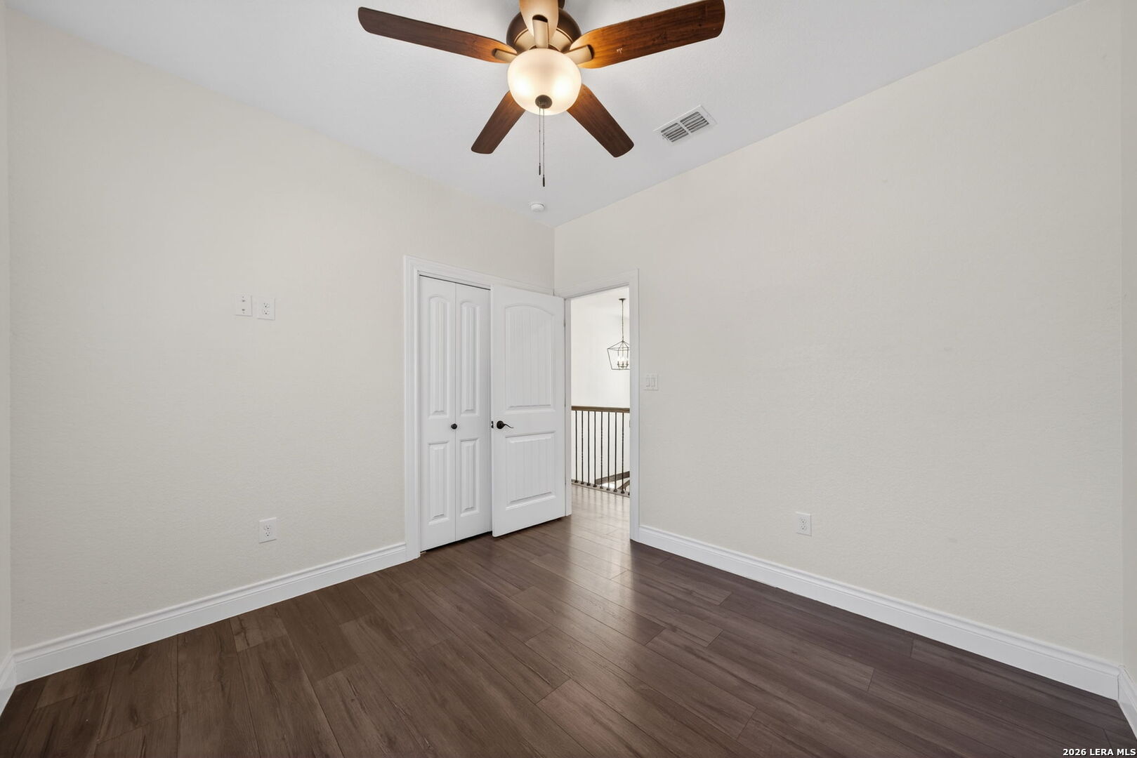 616 Crossman Fischer, TX 78623 - Photo 23 of 48 a big room with wooden floor a ceiling fan and chandelier fan