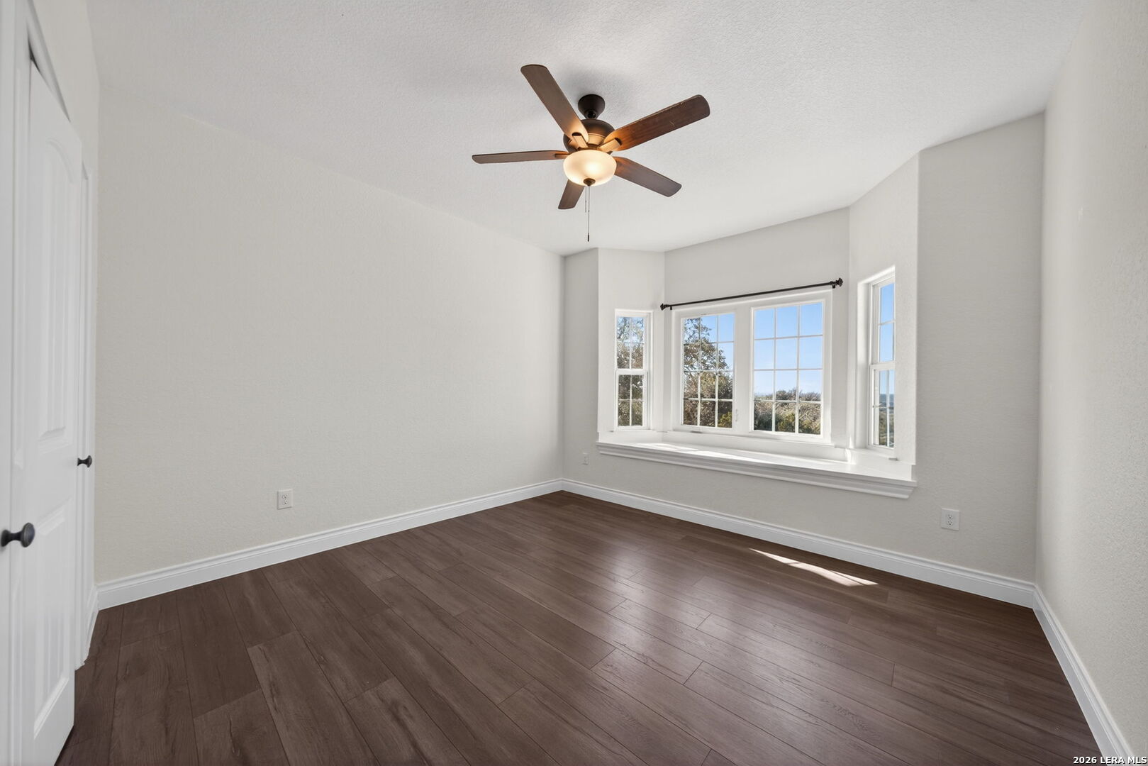 616 Crossman Fischer, TX 78623 - Photo 27 of 48 a view of wooden floor and a window in a room