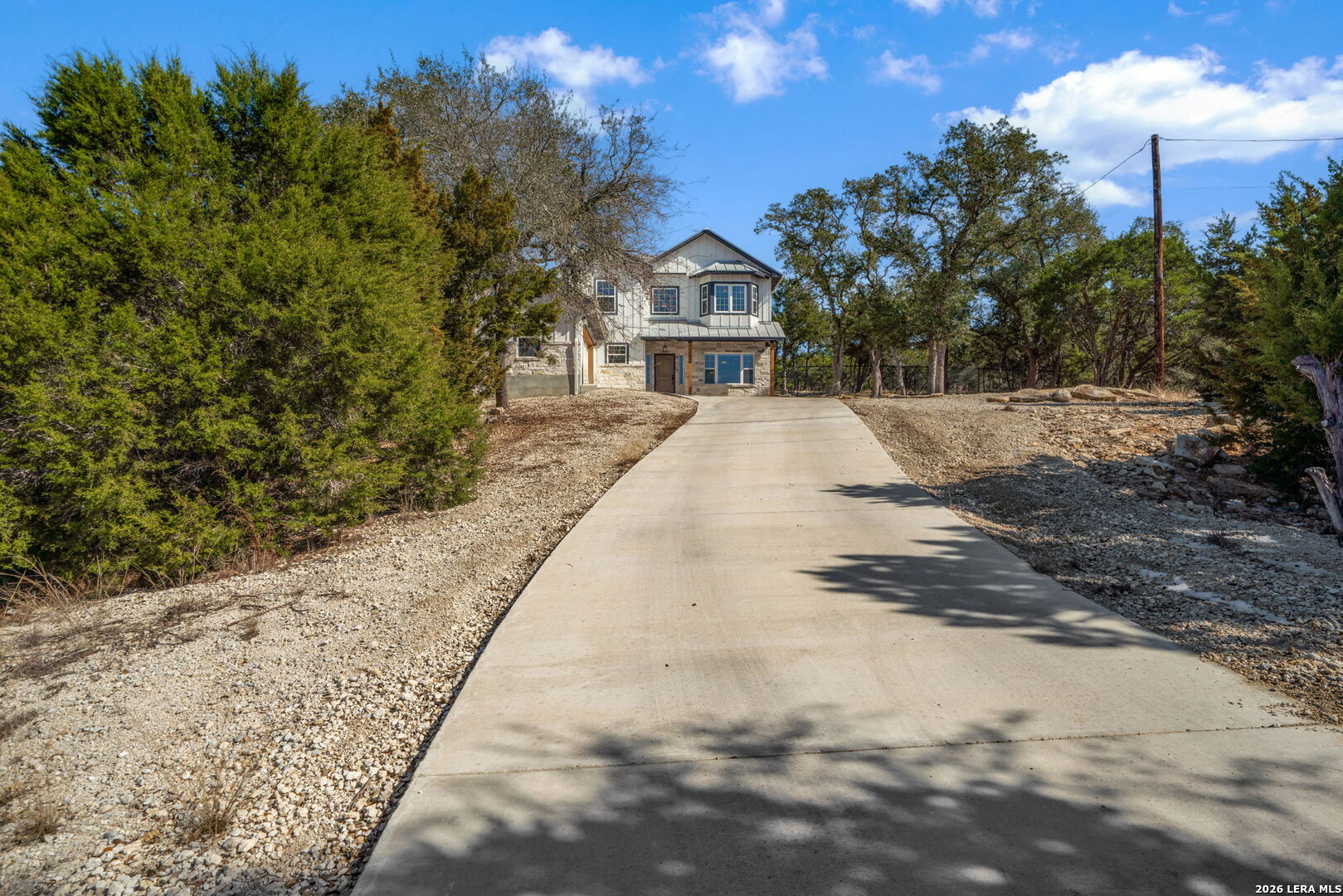 616 Crossman Fischer, TX 78623 - Photo 3 of 48 a view of house with a yard and trees in the background
