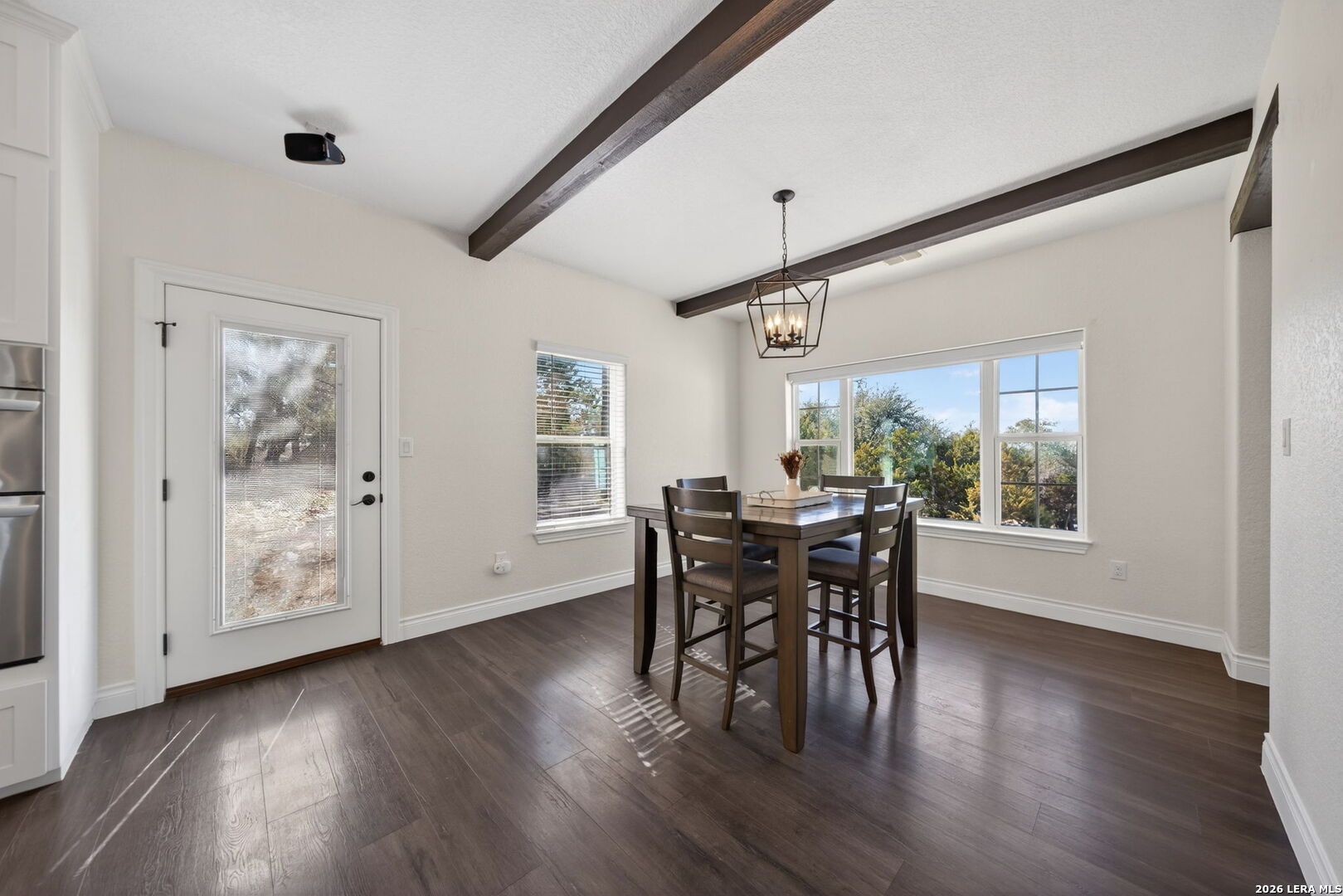 616 Crossman Fischer, TX 78623 - Photo 7 of 48 a view of a dining room with furniture and wooden floor