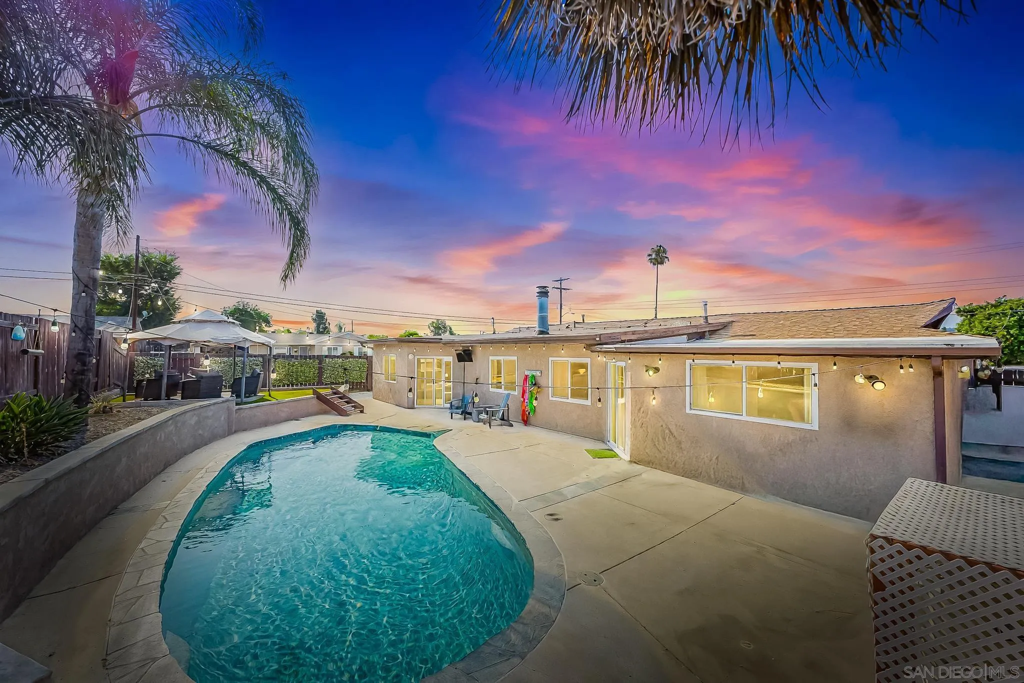 a view of a swimming pool with a patio