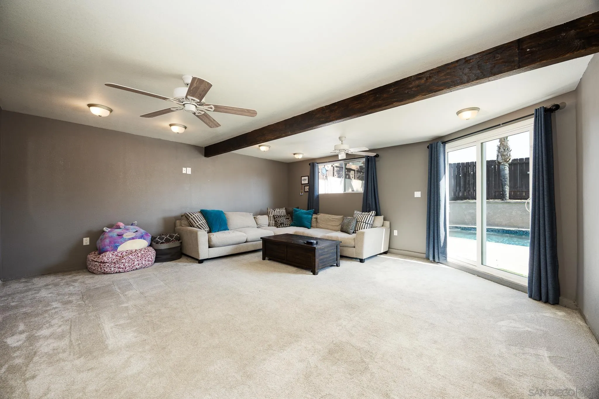 9276 Ruffin Road Santee, CA 92071 - Photo 15 of 40 a spacious bedroom with furniture and window