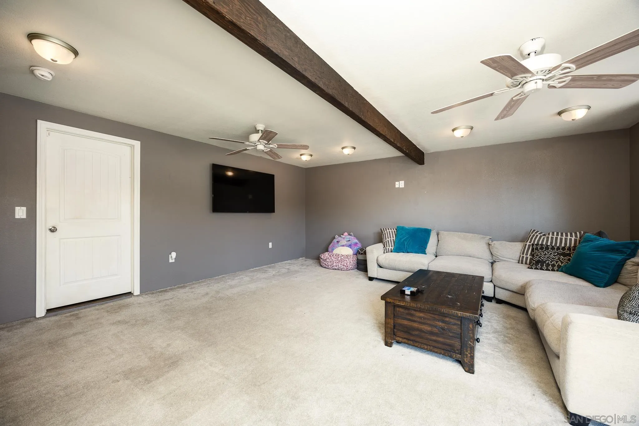 9276 Ruffin Road Santee, CA 92071 - Photo 16 of 40 a living room with furniture and a flat screen tv