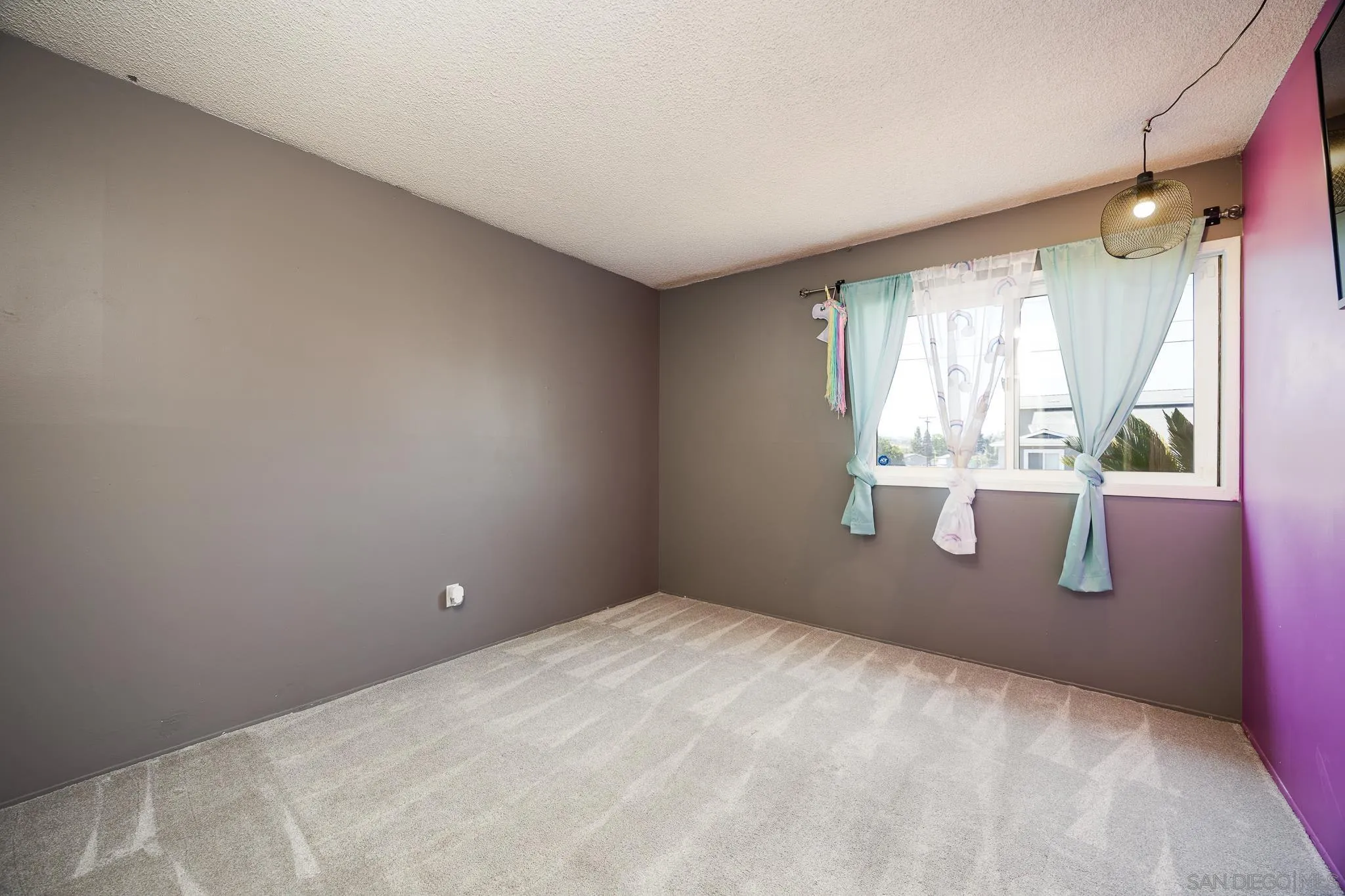 9276 Ruffin Road Santee, CA 92071 - Photo 19 of 40 a room with window and outdoor space