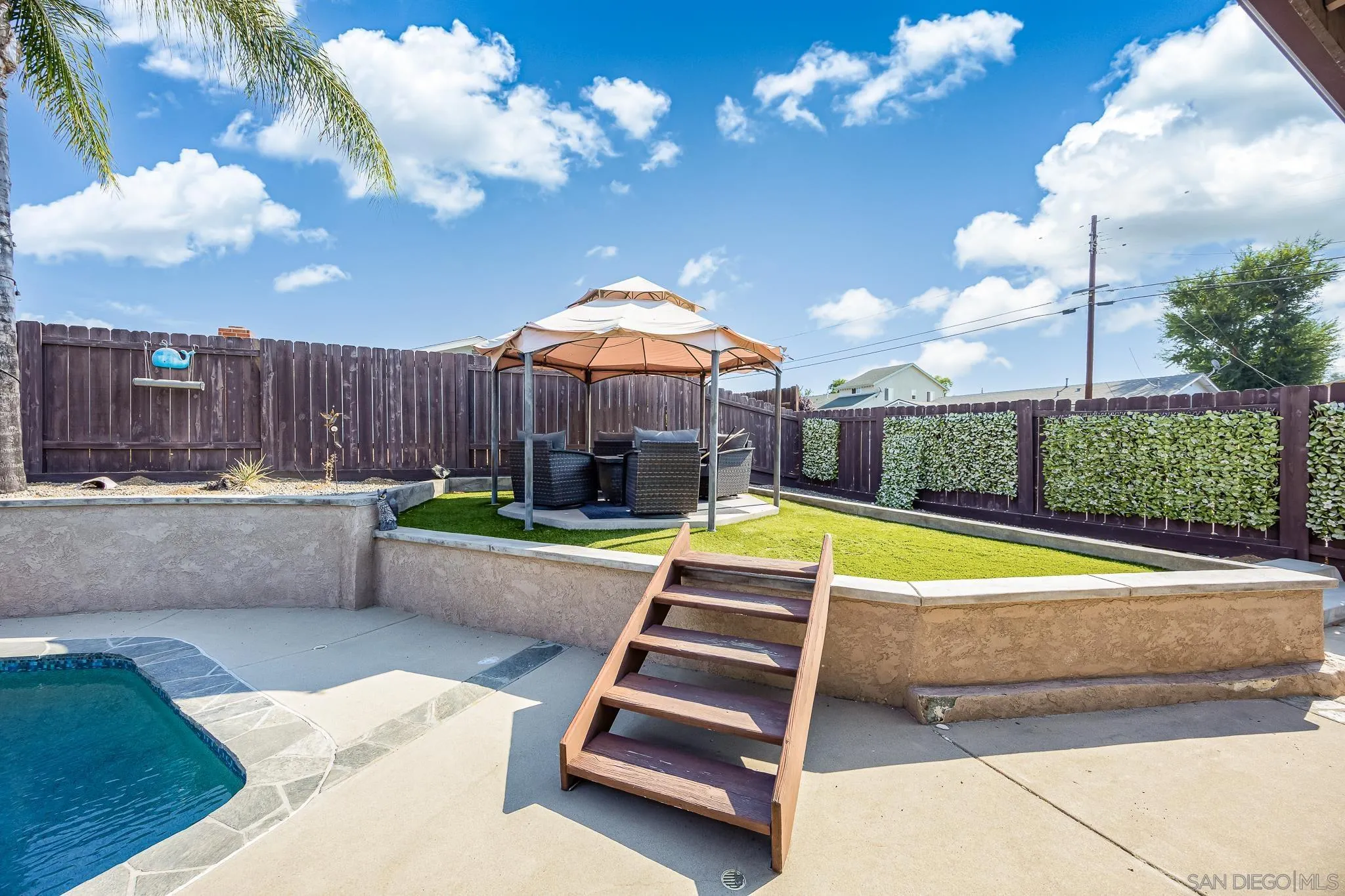 9276 Ruffin Road Santee, CA 92071 - Photo 28 of 40 a backyard with swimming pool and outdoor seating