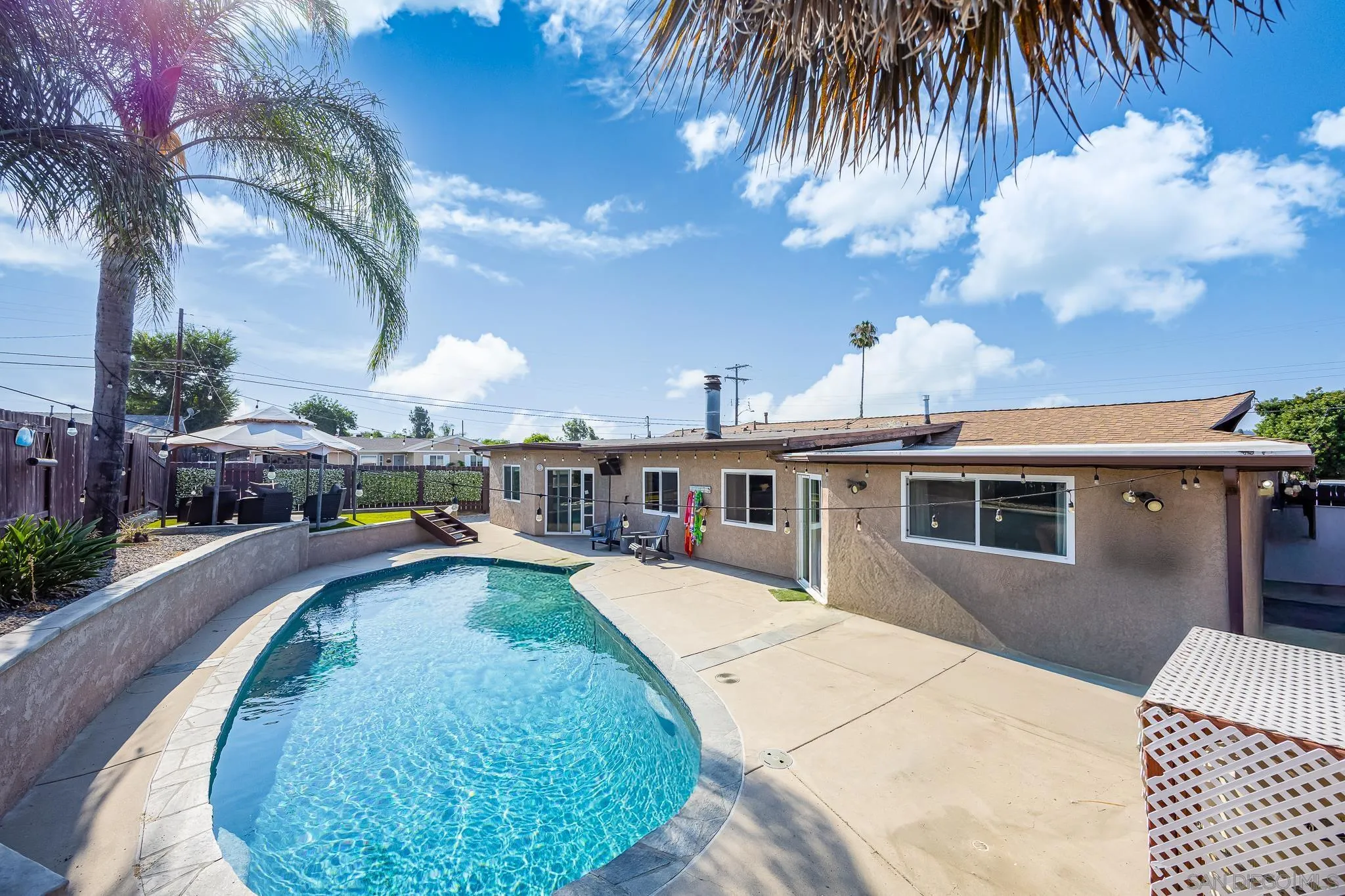 9276 Ruffin Road Santee, CA 92071 - Photo 30 of 40 a view of a house with swimming pool