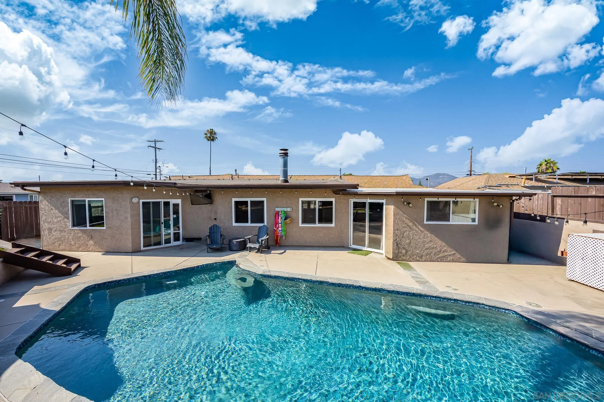 9276 Ruffin Road Santee, CA 92071 - Photo 31 of 40 a front view of a house with yard and seating area