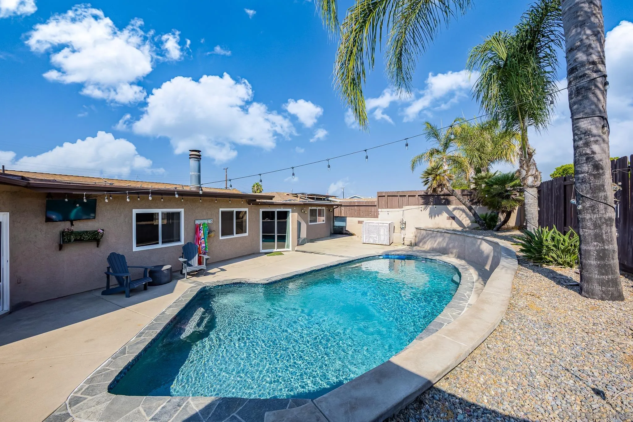 9276 Ruffin Road Santee, CA 92071 - Photo 32 of 40 a swimming pool with outdoor seating yard and barbeque oven