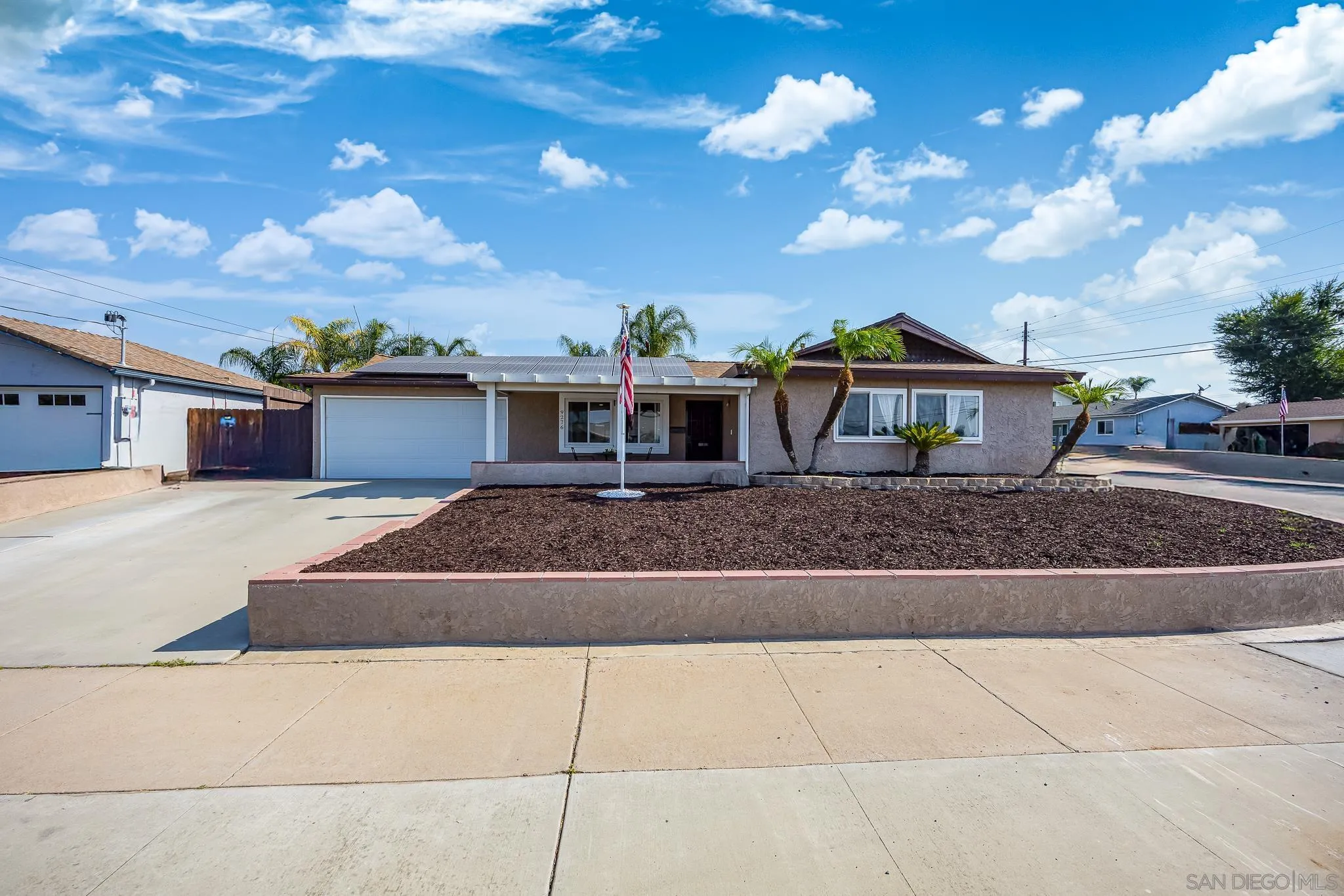 9276 Ruffin Road Santee, CA 92071 - Photo 33 of 40 a front view of a house with a yard