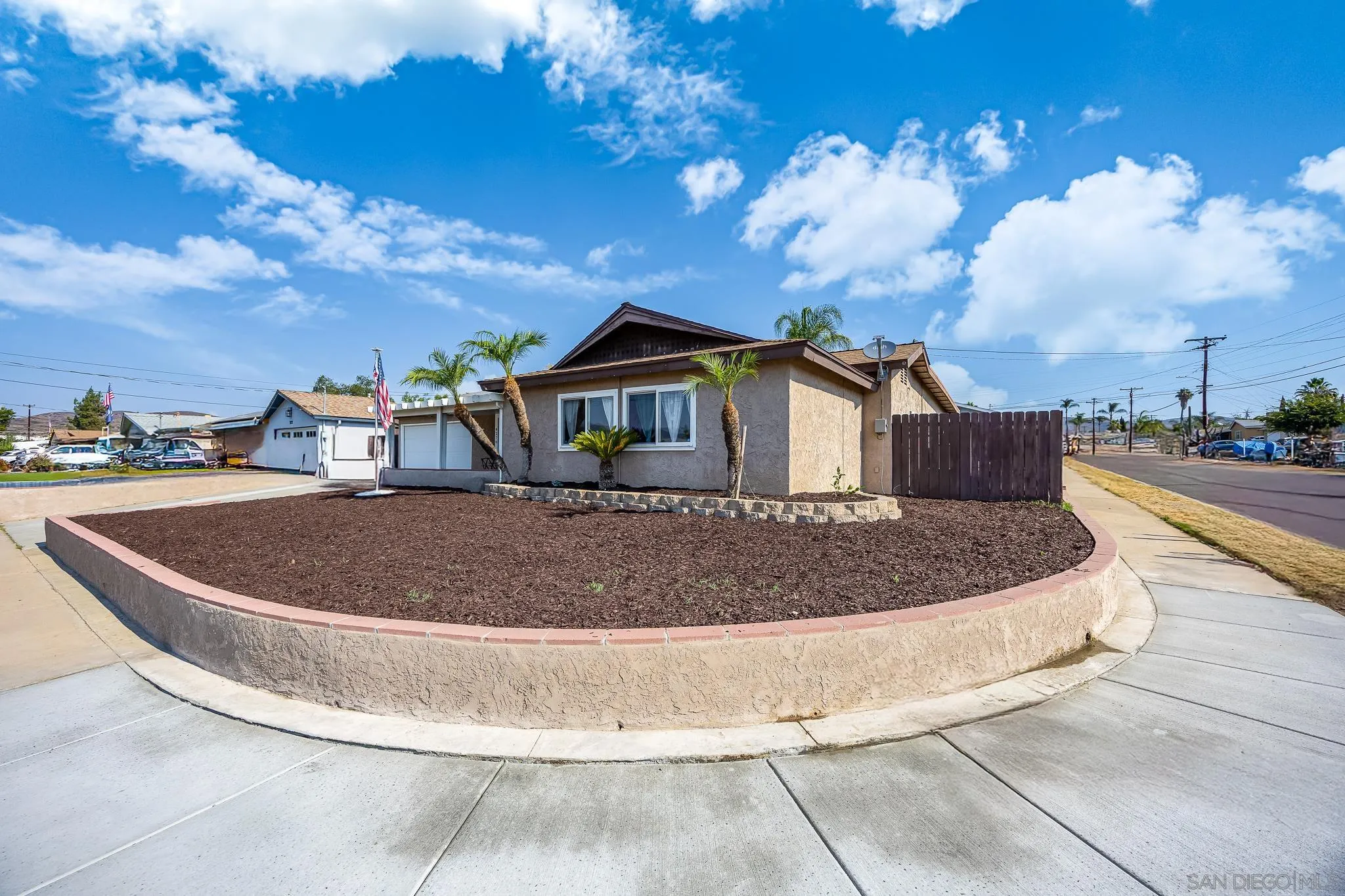 9276 Ruffin Road Santee, CA 92071 - Photo 7 of 40 a view of a house with a swimming pool and a yard
