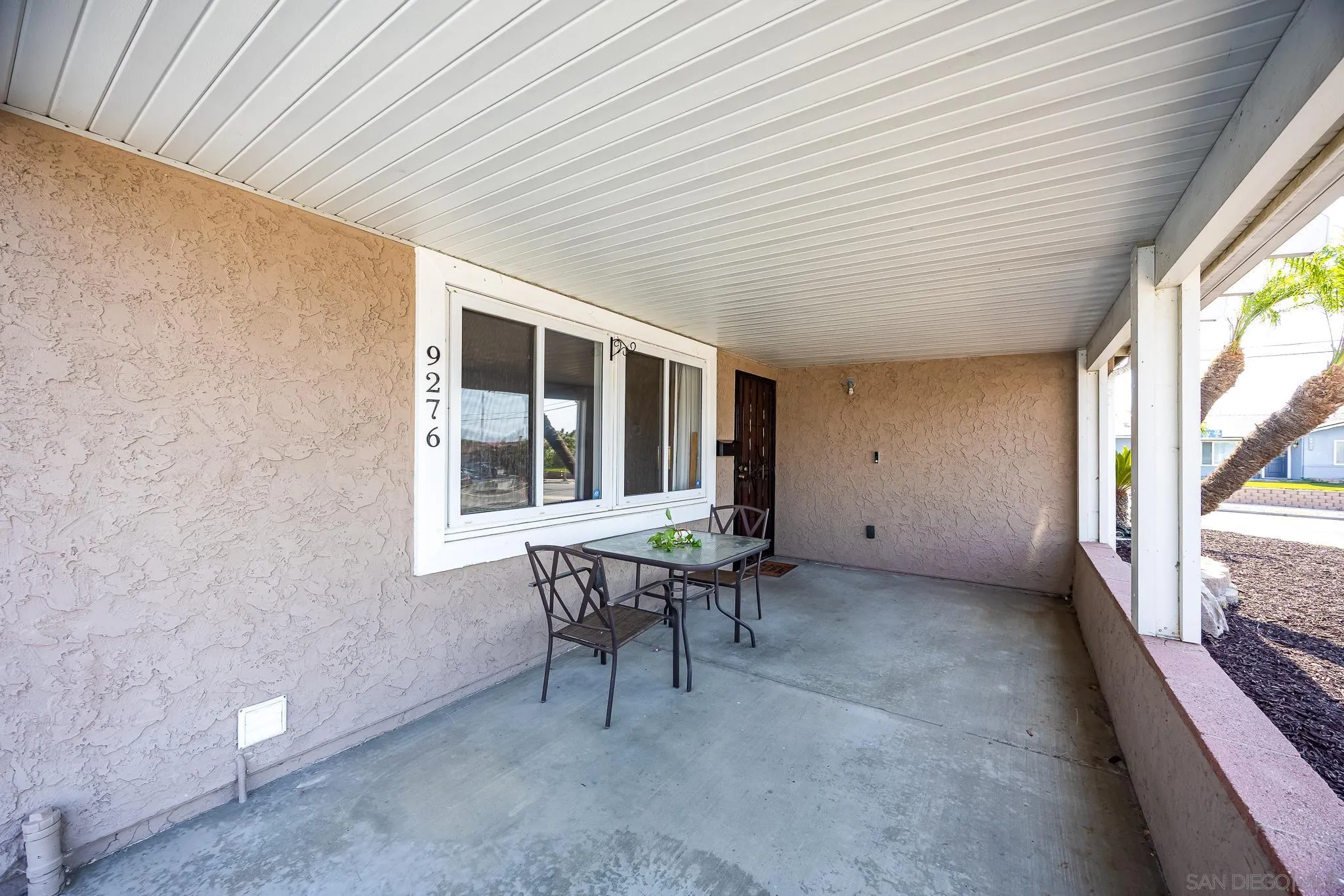 9276 Ruffin Road Santee, CA 92071 - Photo 9 of 40 a view of a house with a backyard and a patio