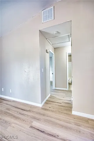 a view of an empty room with a window