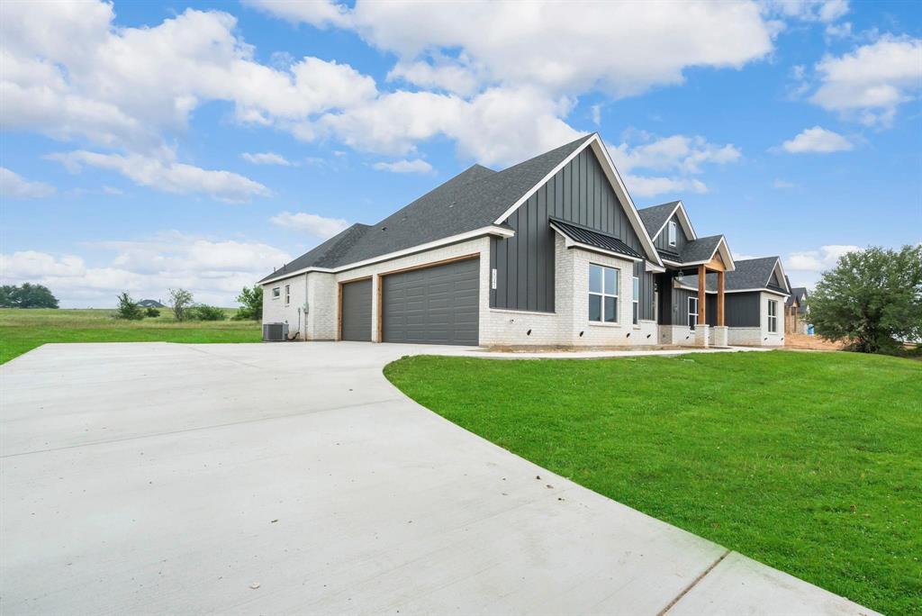 2041 Carrie Court Weatherford, TX 76088 - Photo 2 of 36 front view of house with a yard