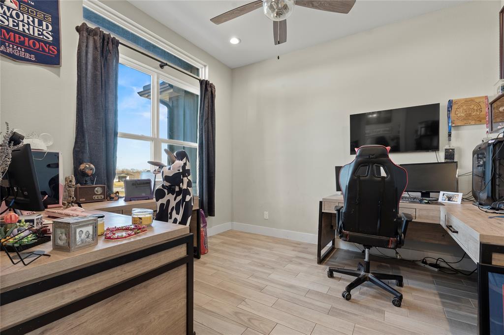 2041 Carrie Court Weatherford, TX 76088 - Photo 22 of 36 a view of a workspace with furniture and a window