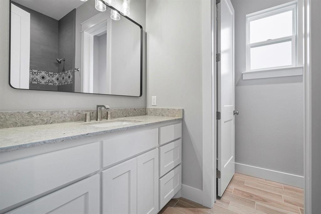2041 Carrie Court Weatherford, TX 76088 - Photo 24 of 36 a bathroom with a sink and a mirror