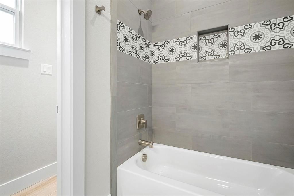 2041 Carrie Court Weatherford, TX 76088 - Photo 25 of 36 a bathroom with a bathtub and shower