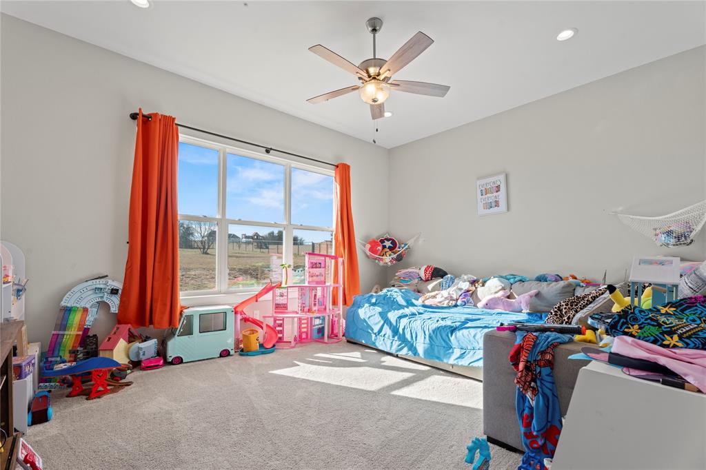 2041 Carrie Court Weatherford, TX 76088 - Photo 29 of 36 a bedroom with furniture and toys