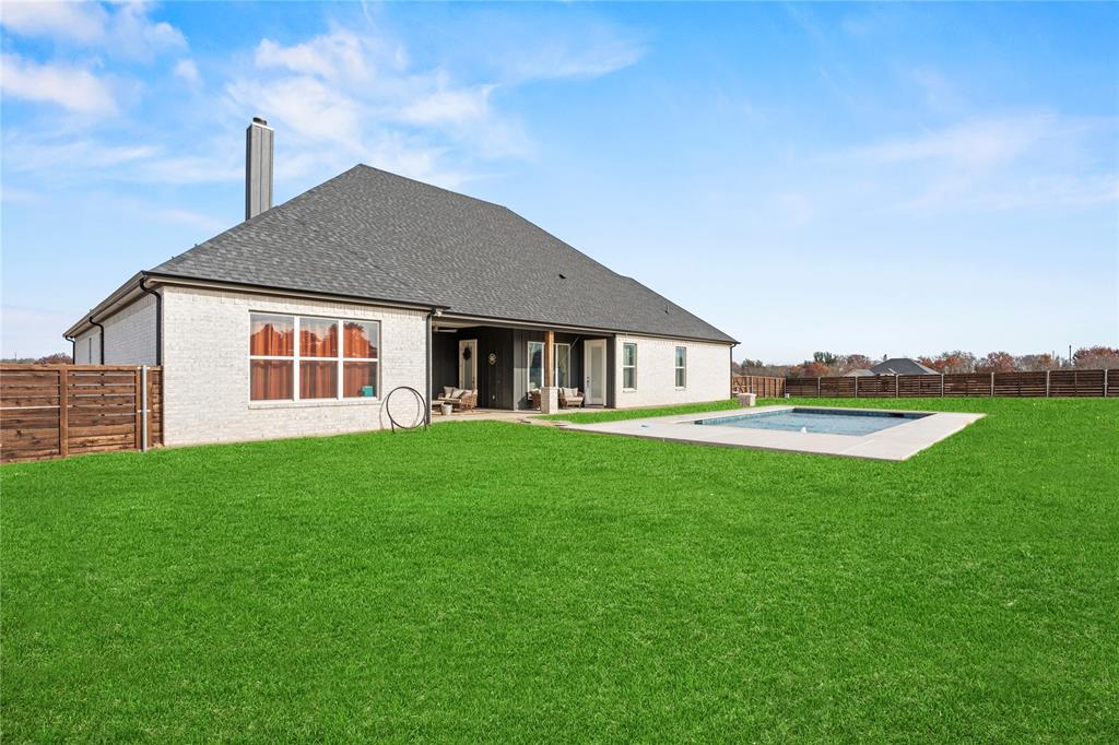 2041 Carrie Court Weatherford, TX 76088 - Photo 31 of 36 a front view of a house with garden