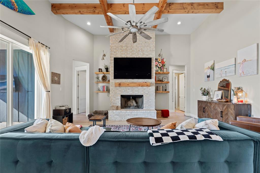 2041 Carrie Court Weatherford, TX 76088 - Photo 6 of 36 a living room with furniture fireplace and flat screen tv