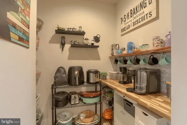 a kitchen with a stove and cabinets