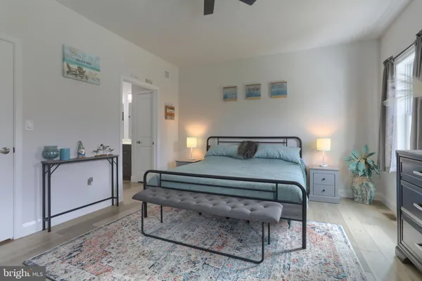 a bedroom with a bed and a dresser