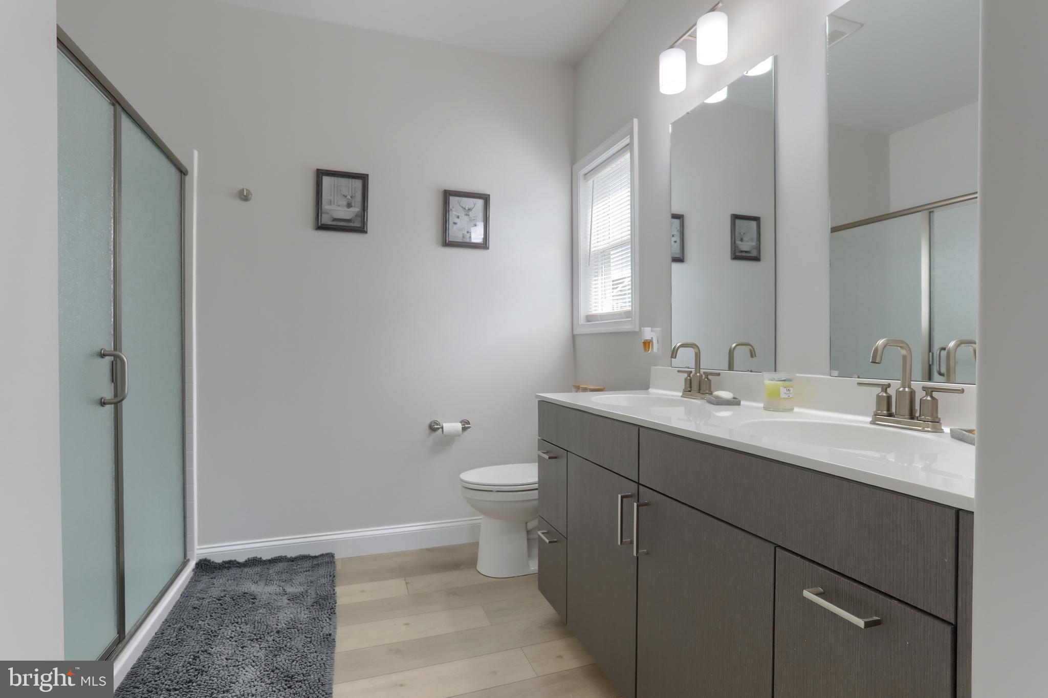 1100 Alden Way Lebanon, PA 17042 - Photo 25 of 52 a bathroom with a double vanity sink toilet and a mirror