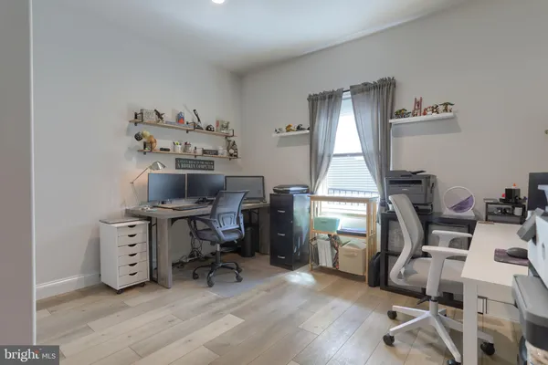 a workspace with furniture hardwood and a window