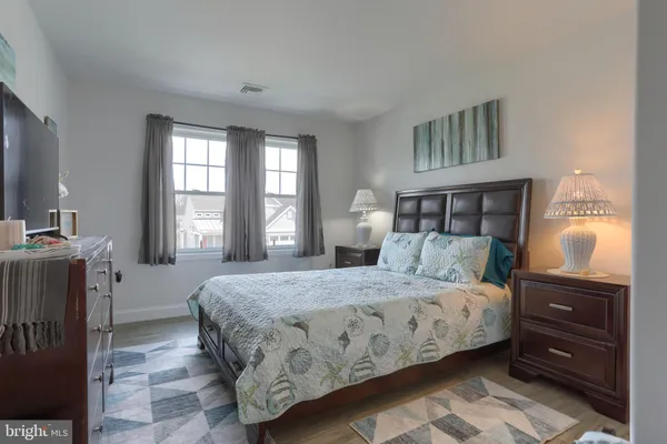 a bedroom with a bed and a dresser