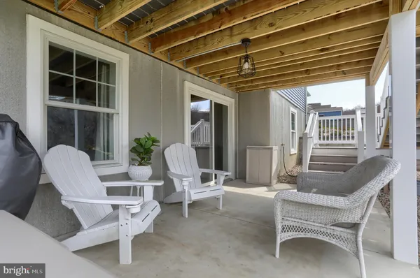 a view of a chairs and table in a patio