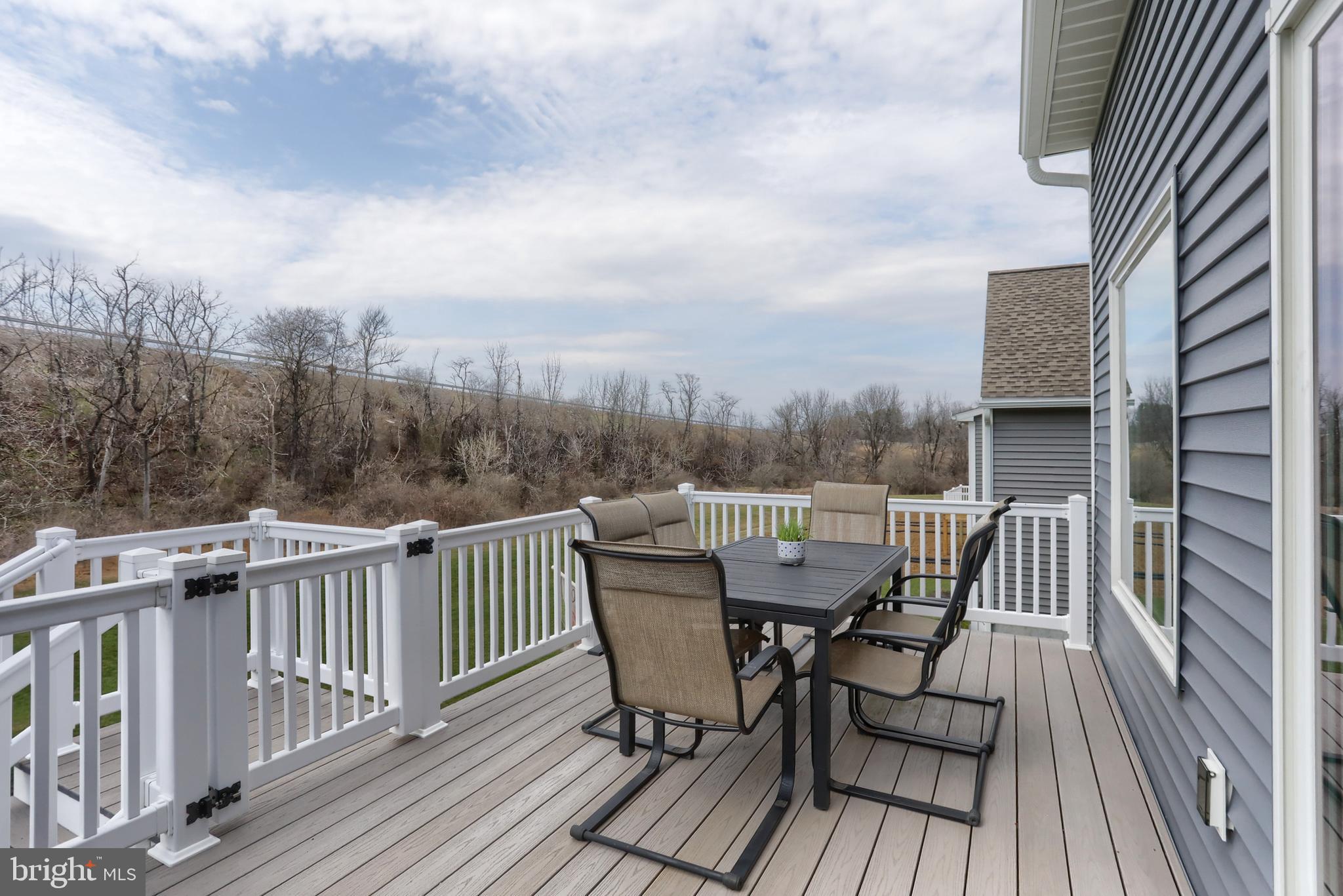 1100 Alden Way Lebanon, PA 17042 - Photo 51 of 52 a view of a roof deck with table and chairs and wooden floor