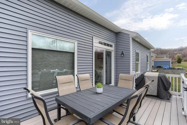 a view of a deck with furniture