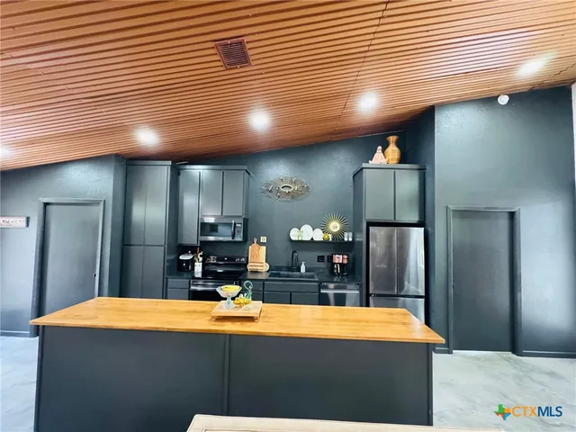 a view of a room with kitchen island table and chairs