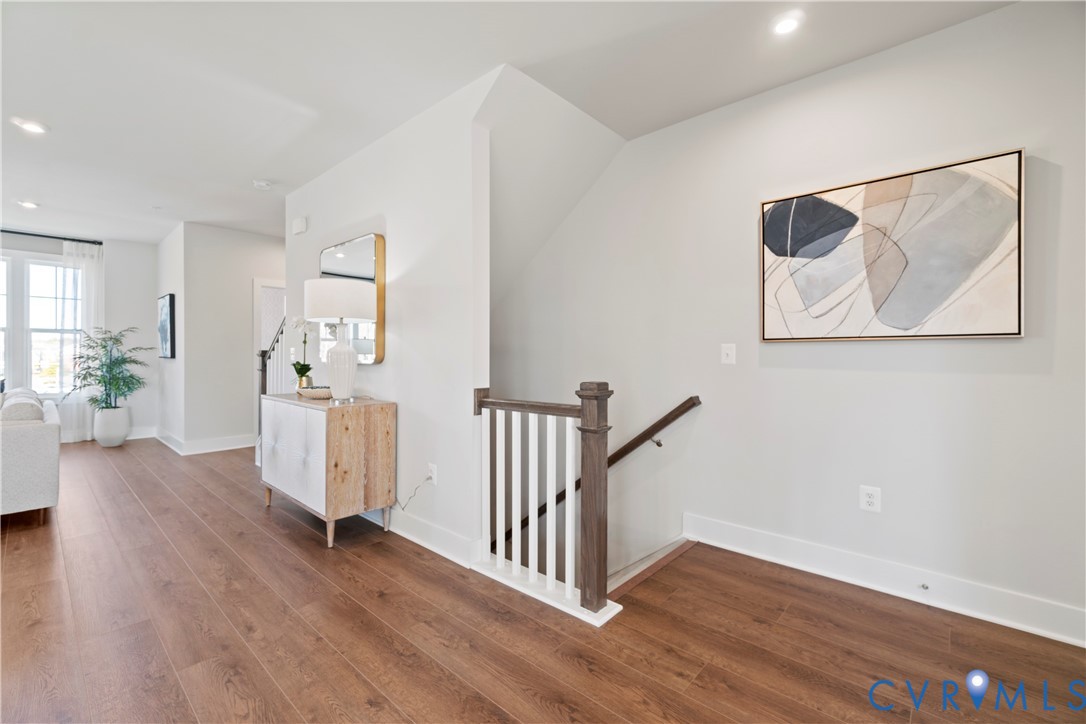 3603 Edna Path, Unit B Henrico, VA 23233 - Photo 6 of 41 a view of a hallway with wooden floor and a bookshelf