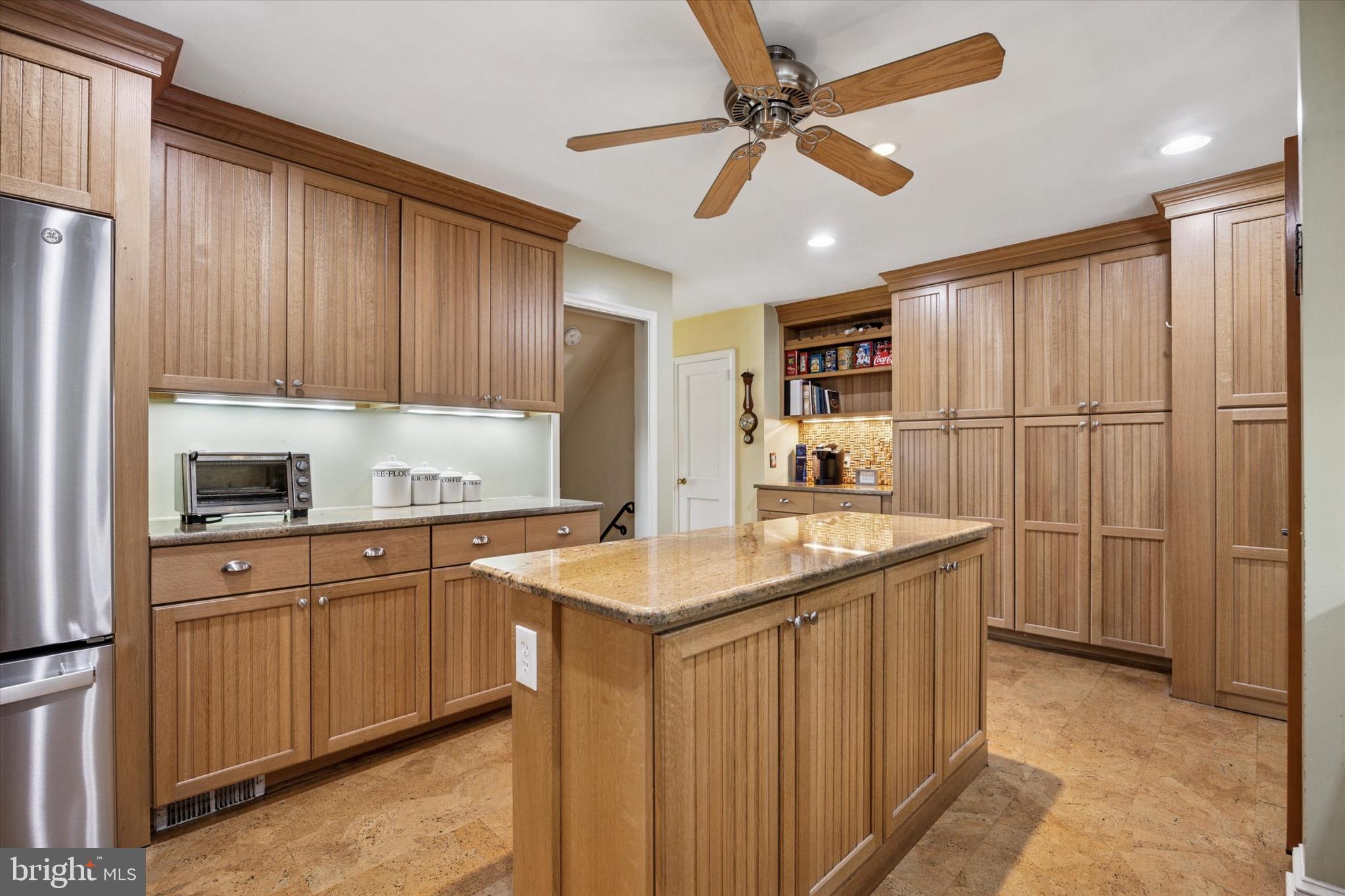 444 Kerr Lane Springfield, PA 19064 - Photo 14 of 35 a kitchen with kitchen island a sink stainless steel appliances and cabinets