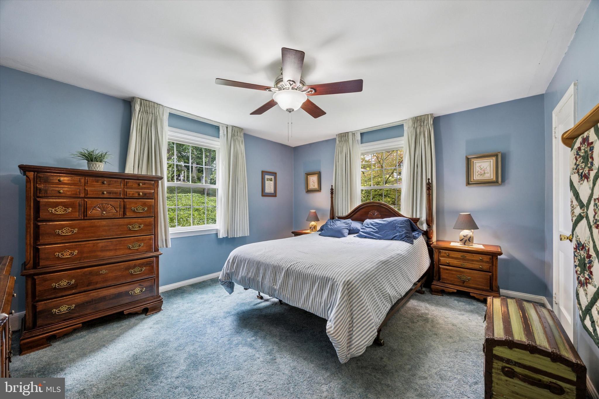 444 Kerr Lane Springfield, PA 19064 - Photo 19 of 35 a bedroom with a bed and a chandelier