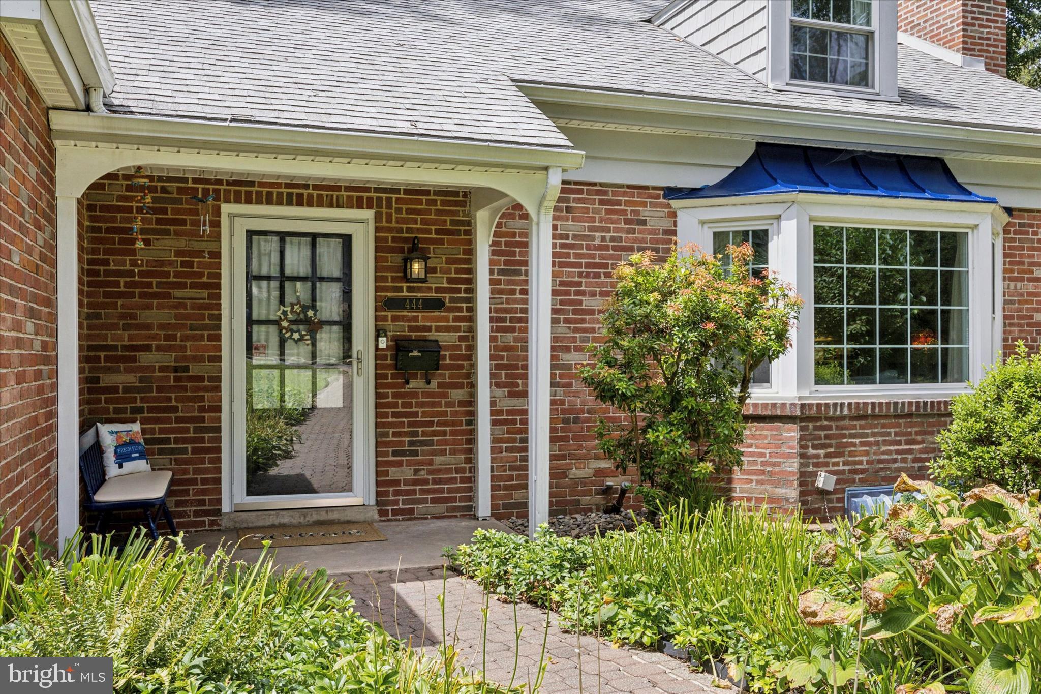 444 Kerr Lane Springfield, PA 19064 - Photo 2 of 35 a view of a brick house with plants