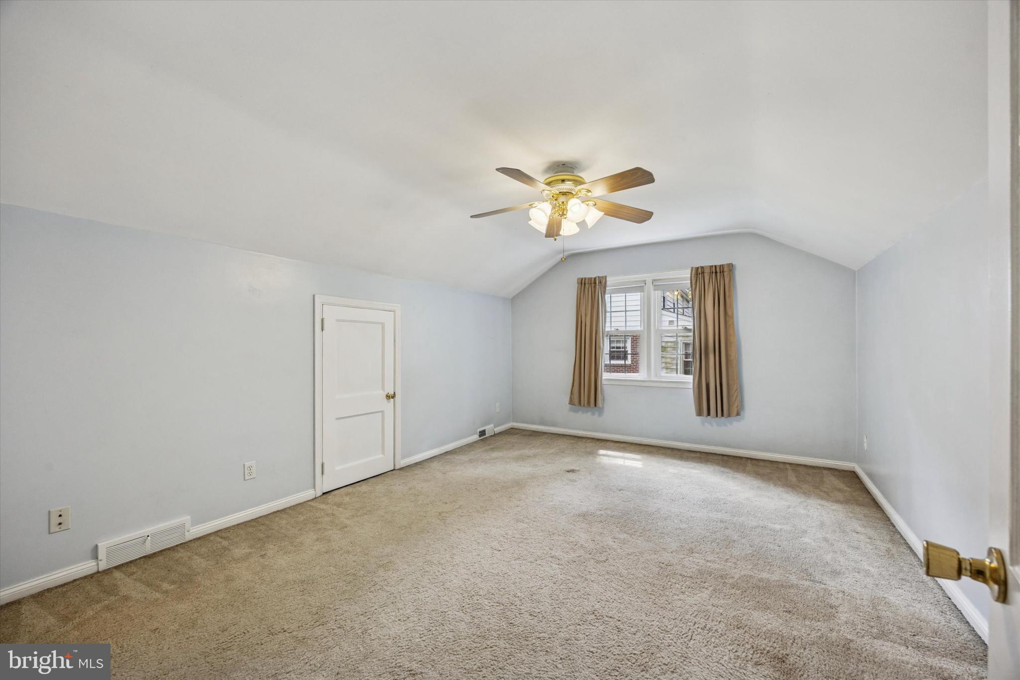 444 Kerr Lane Springfield, PA 19064 - Photo 26 of 35 an empty room with windows and chandelier fan