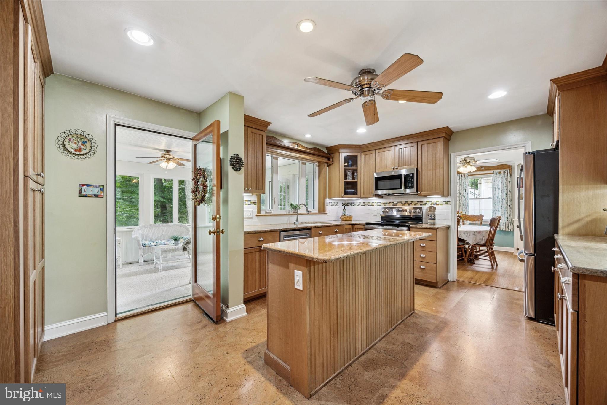 444 Kerr Lane Springfield, PA 19064 - Photo 10 of 35 a kitchen with stainless steel appliances granite countertop a refrigerator and a stove top oven