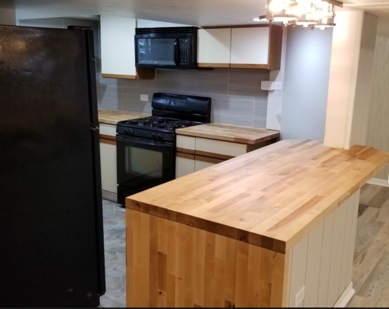 14345 Park Avenue, Unit GARDEN Harvey, IL 60426 - Photo 4 of 6 a kitchen with a stove and a refrigerator