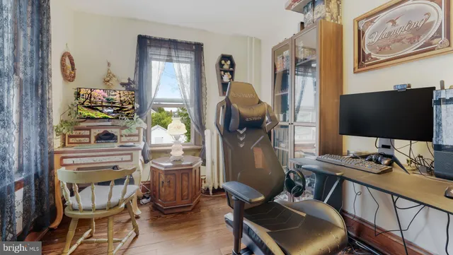 a room with furniture and a flat screen tv