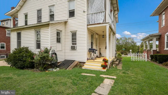 a view of a balcony with floor to ceiling windows with wooden floor