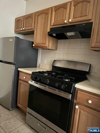 a kitchen with cabinets and a sink