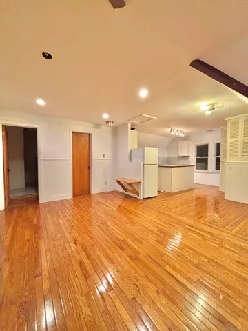 a view of a kitchen and a room