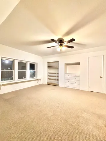 a view of house with wooden floor and a floor to ceiling window