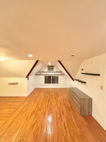 a bathroom with a toilet a sink and a mirror