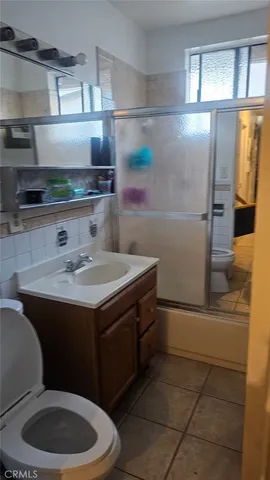 a kitchen with a sink a stove and a refrigerator