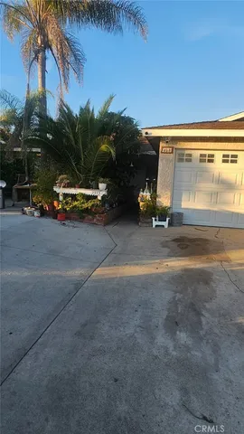 a view of a parking area with a car parked in front of it