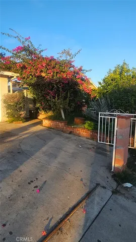 a view of building with car parked